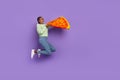 Full length picture of excited girl in trendy clothes bite huge pizza slice feeling hungry isolated on purple color