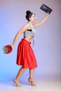 Full length pin-up girl woman with clock is late for date. Royalty Free Stock Photo