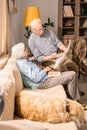 Senior Couple Reading Newspaper at Home Royalty Free Stock Photo