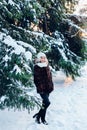 Full length portrait of afro american girl wearing in fur coat in winter park Royalty Free Stock Photo