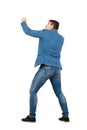 Full length portrait of angry businessman ready for battle standing in fighting position isolated over white background. People