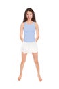 Full length portrait of an attractive brunette woman wearing a white skirt over a blue bathing suit Royalty Free Stock Photo