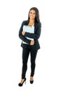 Full length portrait of Attractive latin corporate latin woman looking excited and holding folder and paperwork in Creative Royalty Free Stock Photo