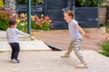 Full length portrait of attractive, playful, cheerful, happy comic couple children jumping over nature background. Royalty Free Stock Photo