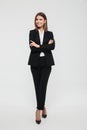 Full length portrait of an attractive smiling businesswoman Royalty Free Stock Photo