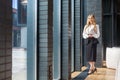 Full length portrait of attractive successful businesswoman with long blond hair in office style clothes Royalty Free Stock Photo