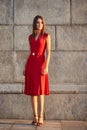 Full length portrait of attractive young woman in a red dress Royalty Free Stock Photo
