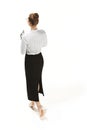 Full length portrait of a back of female teacher holding a folder isolated against white background