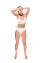 Full length portrait of a beautiful blonde woman wearing a white bikini Royalty Free Stock Photo