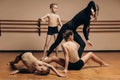 Full-length portrait of a beautiful dance teacher instructing a group of little girls in a dance studio, a space for Royalty Free Stock Photo