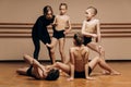 Full-length portrait of a beautiful dance teacher instructing a group of little girls in a dance studio, a space for Royalty Free Stock Photo