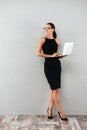 Full length portrait of a beautiful happy businesswoman Royalty Free Stock Photo