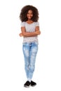 Full length beautiful young african american woman standing with her arms crossed on white background