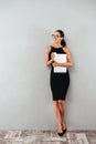 Full length portrait of a beautiful young businesswoman Royalty Free Stock Photo