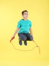 Full length portrait of boy jumping rope Royalty Free Stock Photo