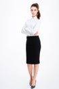 Full length portrait of a businesswoman standing with arms folded Royalty Free Stock Photo