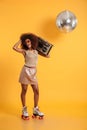 Full length portrait of charming african woman in retro clothes Royalty Free Stock Photo