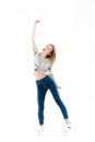 Full length portrait of a cheerful happy girl celebrating success Royalty Free Stock Photo