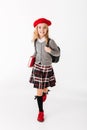 Full length portrait of a cheerful little schoolgirl Royalty Free Stock Photo