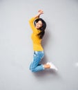 Full length portrait of a cheerful woman jumping Royalty Free Stock Photo
