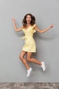 Full length portrait of a cheerful young girl in dress Royalty Free Stock Photo