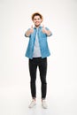 Full length portrait cheerful young man showing thumbs up Royalty Free Stock Photo