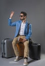 Smiling man in sunglasses waving hand Royalty Free Stock Photo