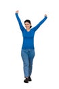 Full length portrait of a cheerful young woman, raising hands up as making a step forward. Celebrate success like a winner, Royalty Free Stock Photo