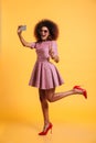 Full length portrait of a cheery afro american woman Royalty Free Stock Photo