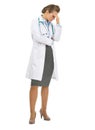 Full length portrait of concerned doctor woman