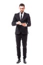 Full length portrait of a confident businessman using tablet computer isolated on a white background Royalty Free Stock Photo