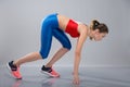 Full length portrait of a confident focused sportswoman getting ready to start running while posing Royalty Free Stock Photo