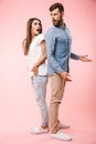 Full length portrait of a confused young couple Royalty Free Stock Photo