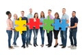 Creative Business People Holding Jigsaw Pieces Royalty Free Stock Photo