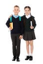 Full length portrait of cute children in school uniform on white Royalty Free Stock Photo