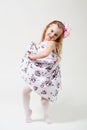 Full length portrait of a cute little blonde girl dancing Royalty Free Stock Photo