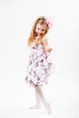 Full length portrait of a cute little blonde girl dancing Royalty Free Stock Photo