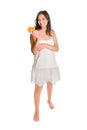 Full length portrait of a cute young woman holding a half orange Royalty Free Stock Photo