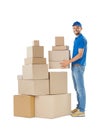 Full length portrait of delivery man holding stack of boxes