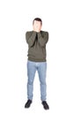 Full length portrait of disappointed young man, facepalm gesture, covering face with his hands. Depressed person suffering