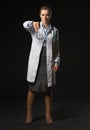 Full length portrait of doctor woman showing thumbs down Royalty Free Stock Photo