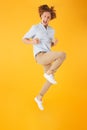 Full length portrait of energetic cheerful man 20s jumping and c Royalty Free Stock Photo