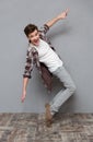 Full length portrait of excited dancing young man