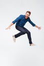 Full length portrait of a excited funny bearded man jumping Royalty Free Stock Photo