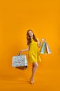 Full length portrait of excited model lady carry many packs enjoying sales shopping
