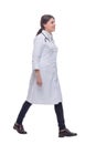 Full length portrait of female doctor walking towards the camera smiling Royalty Free Stock Photo
