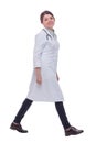 Full length portrait of female doctor walking towards the camera smiling Royalty Free Stock Photo