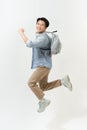 Full length portrait of a funny cheerful male student jumping on white background Royalty Free Stock Photo