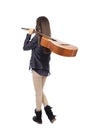 Full length portrait of girl with a guitar on her shoulder, bac Royalty Free Stock Photo