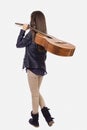 Full length portrait of girl with a guitar on her shoulder, bac Royalty Free Stock Photo